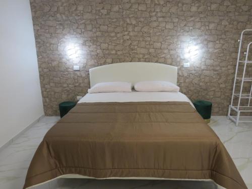 Ένα ή περισσότερα κρεβάτια σε δωμάτιο στο Tortora House