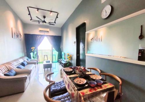 a living room with a couch and a table at Beauty Park View Stay Above DPulze Mall #DP3 in Cyberjaya