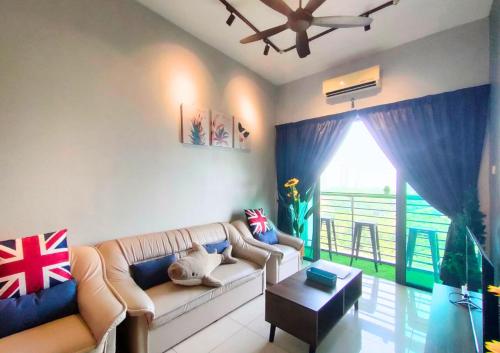 a living room with a couch and a table at Beauty Park View Stay Above DPulze Mall #DP3 in Cyberjaya