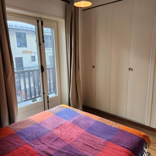 Ένα ή περισσότερα κρεβάτια σε δωμάτιο στο Charmant Duplex à Monêtier Serre-Chevalier