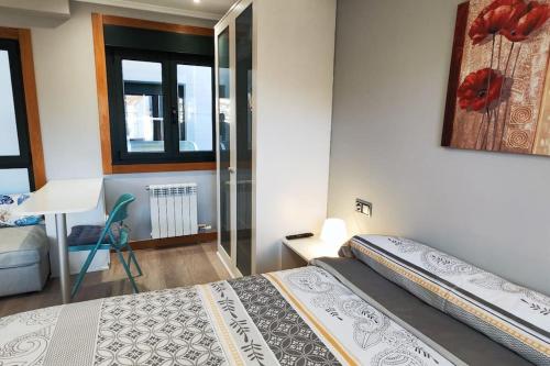 Ένα ή περισσότερα κρεβάτια σε δωμάτιο στο Joaquin Lóriga diseño centro Vigo