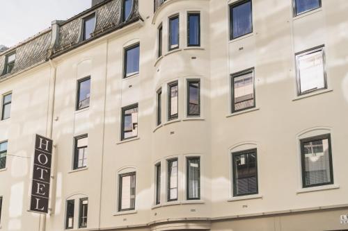 a facade of a building with windows at Heimen Hotel in Bergen