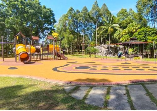 a playground in a park with a slide at Beauty Park View Stay Above DPulze Mall #DP3 in Cyberjaya