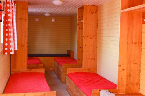 a room with four bunk beds in a sauna at Circus Fantasia in Rostock