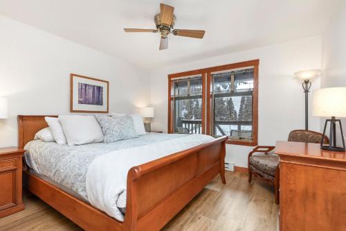 a bedroom with a bed and a ceiling fan at Powderhorn Lodge 210: Blazing Star Suite in Solitude