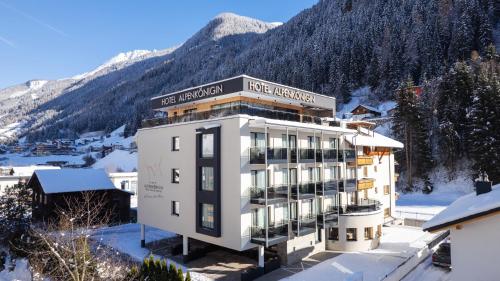 a hotel in the mountains with snow on the ground at Hotel Alpenkönigin - ALPINE LUXURY in See