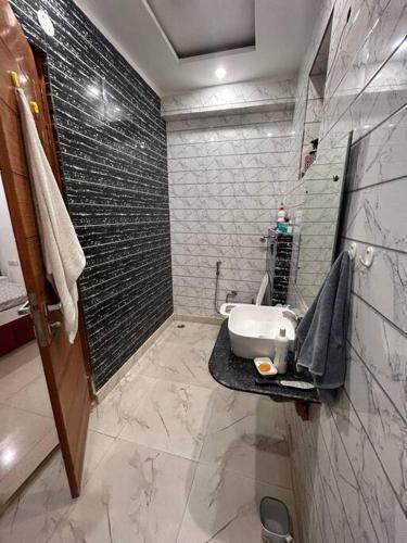 a bathroom with a sink and a shower at Charming Retreat in New Delhi