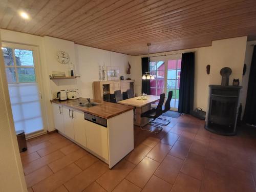 a kitchen with a counter and a stove in it at Ferienwohnung Kajüte 19 in Greetsiel