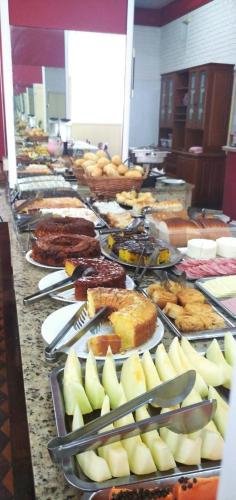 a long buffet of food on a table at Grande Hotel Torres in Torres