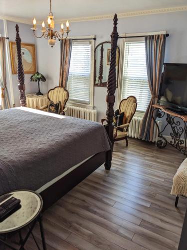 a bedroom with a bed and a piano at Chelsea Pub and Inn in Atlantic City