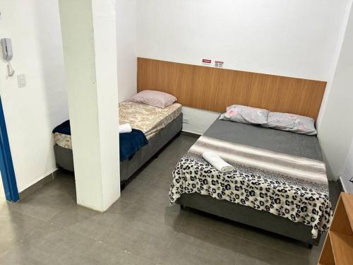 Tempat tidur dalam kamar di Studio mobiliado em São Paulo Vila Guilherme - Expo Center Norte