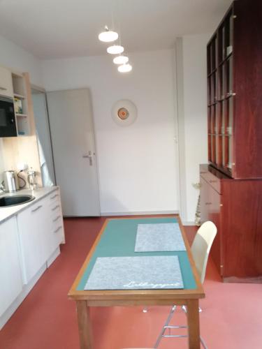 a kitchen with a table and a counter top at Architekten Villa in Theaternähe in Meiningen