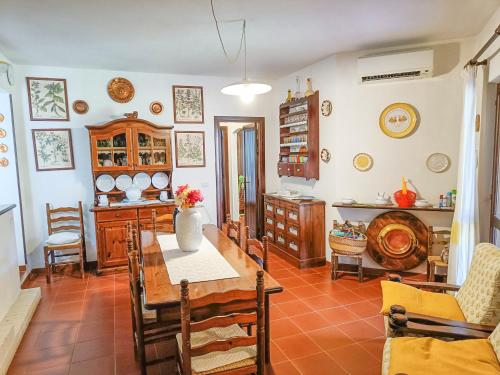 a dining room with a table and chairs at Villa Alice e Silvia - Chia in Chia