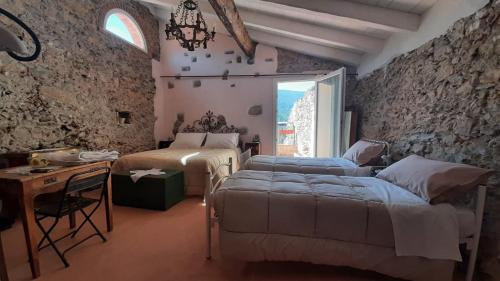 Ένα ή περισσότερα κρεβάτια σε δωμάτιο στο B&B L' Antica Macina