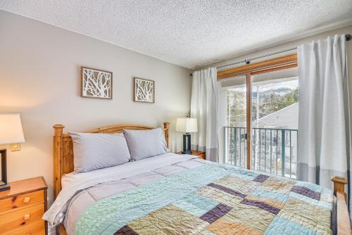 a bedroom with a bed and a window at Ski-InandSki-Out Winter Park Condo with Mountain Views in Winter Park