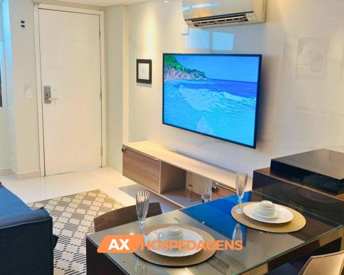 AX Blue Suítesにあるテレビまたはエンターテインメントセンター