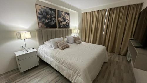 En eller flere senge i et værelse på JM APART CATEGORÍA