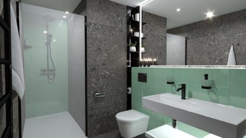 a bathroom with a sink and a toilet and a shower at EA Embassy Prague Hotel in Prague