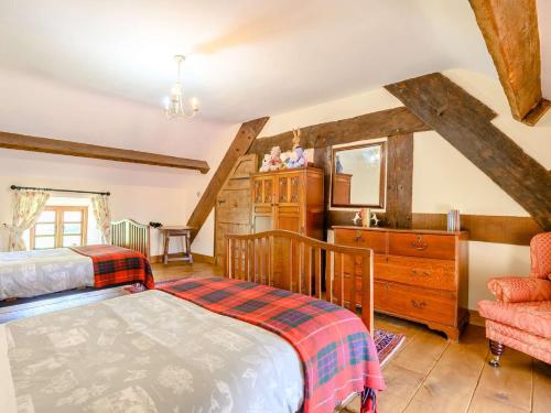 a bedroom with a bed and a sink in a room at 3 Bed in Abergavenny BN324 in Abergavenny