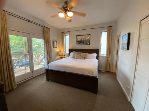 a bedroom with a bed and a ceiling fan at Hidden East Village Gem in Chicago