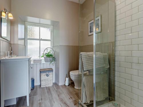 a bathroom with a toilet and a glass shower at 1 Bed in Crieff 85244 in Crieff