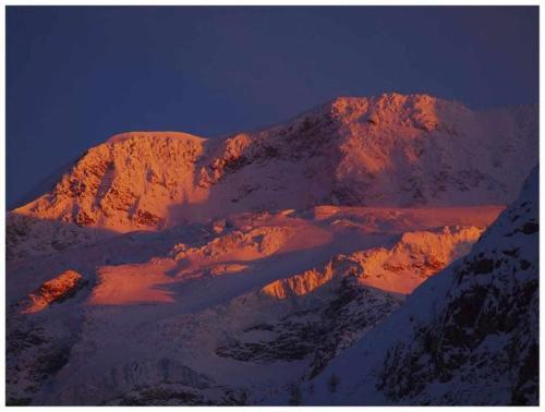 a mountain covered in snow at night at Joie de Vivre Gressoney St Jean in Gressoney-Saint-Jean