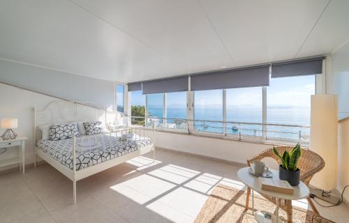 a living room with a couch and a table at Bellavista 2 sea views in Alcudia