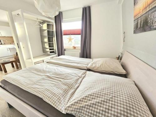 Katil atau katil-katil dalam bilik di Appartementhaus-Kogge-Wohnung-11