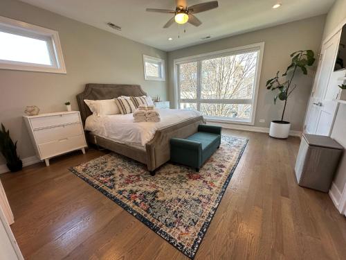 a bedroom with a bed and a rug at Modern SFH Near McCormick Place & Soldier Field in Chicago