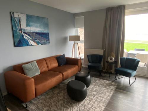 Ruang duduk di RCN Vakantiepark de Schotsman appartement De Caisson