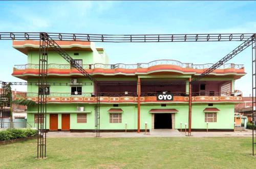 a large green building with a qop sign on it at Ramnagar Varanarasi in Varanasi