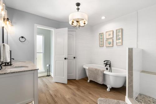 a bathroom with a tub and a sink at 061 Bay Breezes on Port Royal in Dauphin Island
