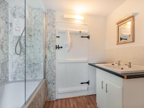 a bathroom with a shower and a sink at 2 Bed in South Molton 86611 in Dennington