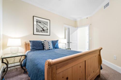 a bedroom with a bed with a blue comforter at 314 Holiday Isle 314 in Dauphin Island