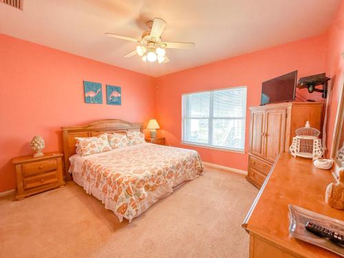 a bedroom with a bed and a ceiling fan at 039 Two Views in Dauphin Island