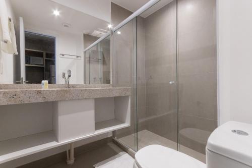 a bathroom with a shower and a toilet at Rooftop #1105 - Suíte em Recife por Carpediem in Recife