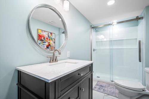a bathroom with a sink and a mirror at 011 The Blue Heron in Dauphin Island
