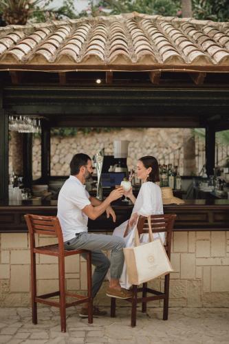 a man and a woman are sitting in chairs at Hotel Bon Sol Resort & Spa in Illetas
