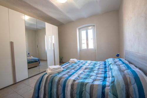 Ένα ή περισσότερα κρεβάτια σε δωμάτιο στο 237 - Casa Colombo Riva Vista Mare a 10metri Spiaggia