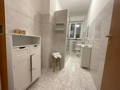 a white bathroom with a sink and a toilet at Casa Sofia Trastevere in Rome