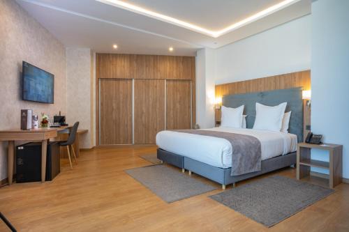 Postel nebo postele na pokoji v ubytování Dominium Hotel