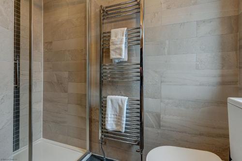 a shower stall in a bathroom with a toilet at Lillies House in Oxford