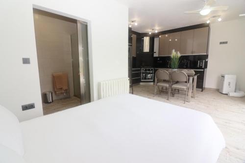 a living room with a table and a dining room at Casa Panorâmica Gerês by Gerês Casas in Geres