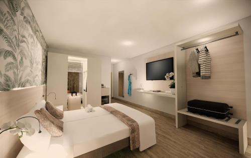 a hotel room with a white bed and a television at Relais Ca Bago' in Costermano