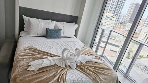 a bedroom with a bed with a teddy bear on it at Breathtaking 1BR in the Heart Miami in Miami