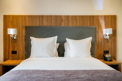 Postel nebo postele na pokoji v ubytování Dominium Hotel