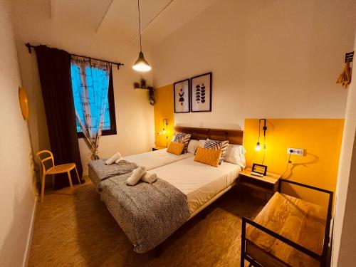 a bedroom with a large bed and a window at Bed and Bike Barcelona in Barcelona