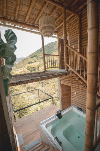 a hot tub in a house with a view at Cabaña campestre para parejas o grupos in Manizales