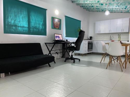 a living room with a couch and a table and chairs at Excelente apartamento Envigado - Full Equipamento. in Envigado
