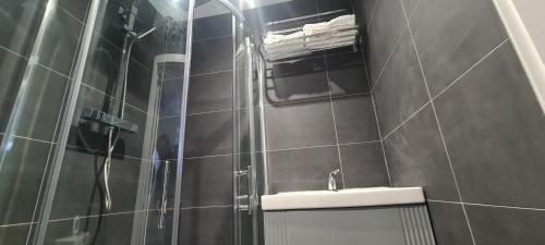 a bathroom with a shower and a sink and a toilet at Home away from home! in Yate